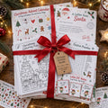 Example Christmas bundle of personalized printables tied with a red ribbon